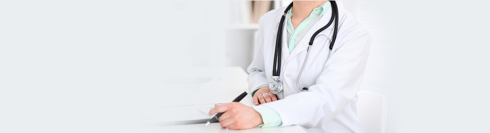 Image of doctor holding pen