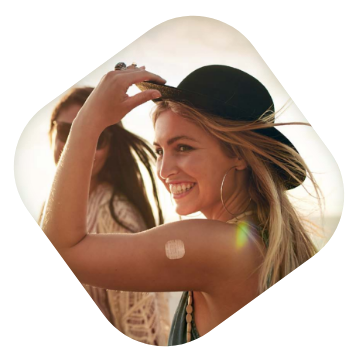 woman in hat wearing XULANE  on upper arm 